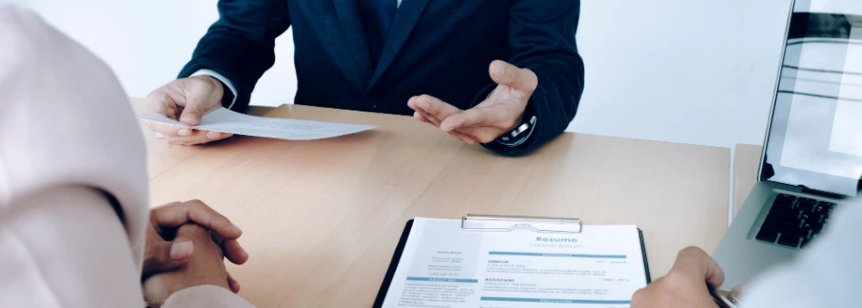 Job seeker examining a professionally-written resume